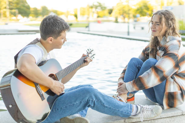 istock Romantic Couple With Guitar 1585259175