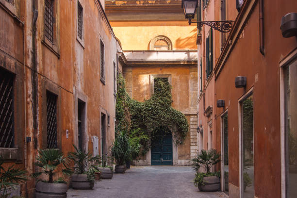 istock orange narrow street in rome 1585260888