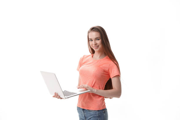 attentive girl student with laptop.isolated on white background - typewriter key audio imagens e fotografias de stock