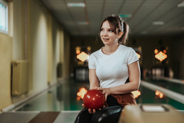 istock Girl In A Bowling Alley 1585277666