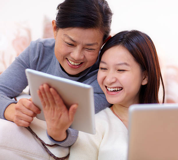 istock mother and daughter using tablet together 158531571