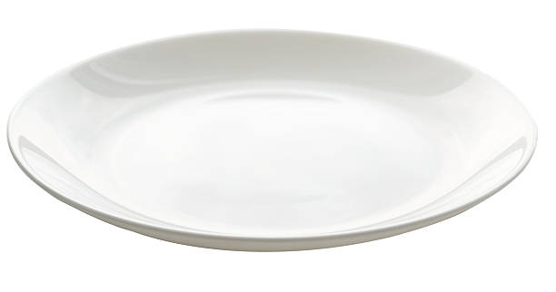 A large white dish against a white background stock photo