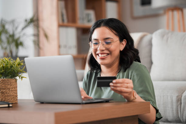 istock Credit card, computer and woman with home online shopping, e learning and fintech payment. Study, student loan and person on laptop for internet banking, college subscription and website transaction 1585324328
