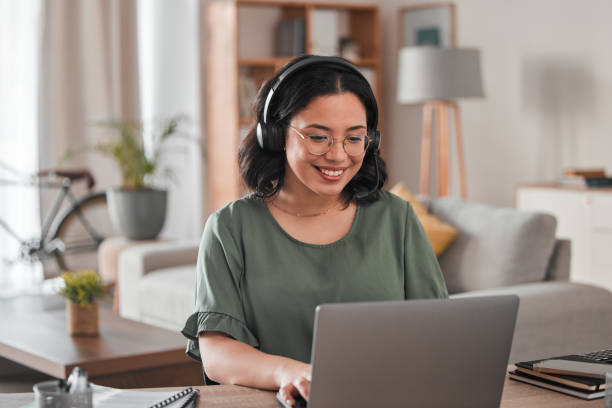 Happy, remote work and woman with a laptop for call center communication and consultation. Smile, virtual assistant and a customer service agent typing on a computer from a house for telemarketing Happy, remote work and woman with a laptop for call center communication and consultation. Smile, advice and a young female customer service agent typing on a computer from a house for telemarketing working at home stock pictures, royalty-free photos & images