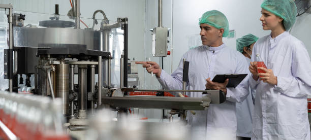 istock Portrait quality supervisor or food or beverages technician inspection about quality control food or beverages before send product to the customer. Production leader recheck ingredient and productivity. 1585328759