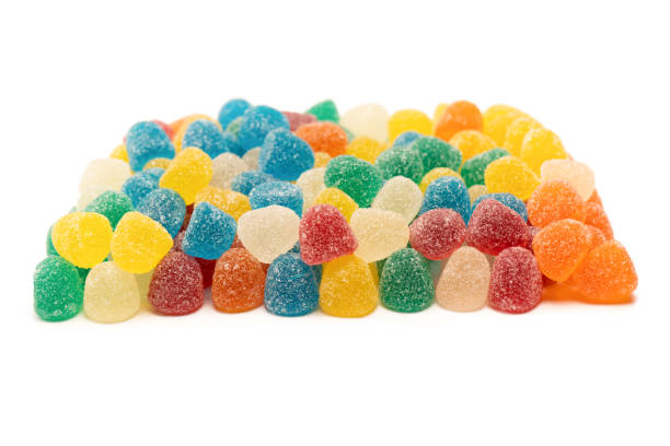 istock Assorted colorful gummy candies isolated on a white background. 1585329850
