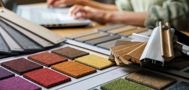 istock variety of design material samples on designers desk in office. banner with copy space 1585334636