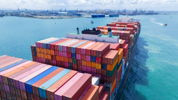 istock Stern of large cargo container ship import export container box on the ocean sea on blue sky back ground concept transportation logistic and service to customer and supply change 1585339674