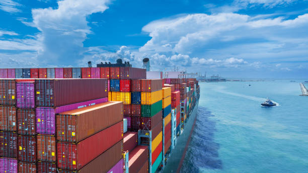 istock Stern of large cargo container ship import export container box on the ocean sea on blue sky back ground concept transportation logistic and service to customer and supply change 1585339681