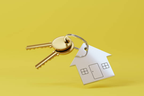 istock House shaped keychain isolated on yellow background. 3d illustration. 1585346376