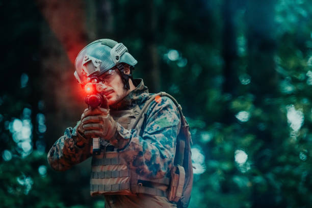 A soldier fights in a warforest area surrounded by fire.