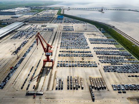 Large number of cars at parking lot,waiting for export at Shanghai port.