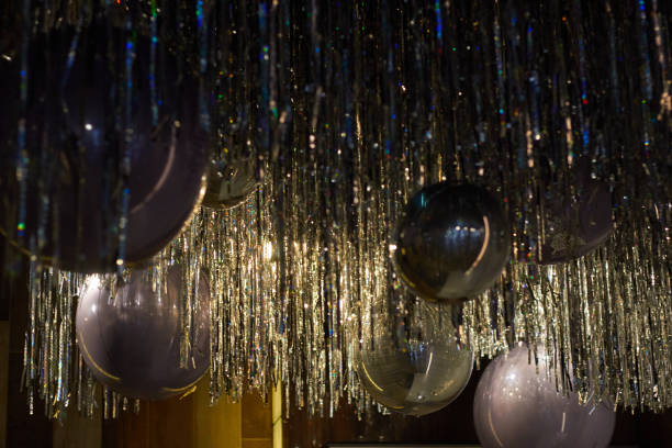 istock ceiling with silver balloons and foil rain. 1585365656