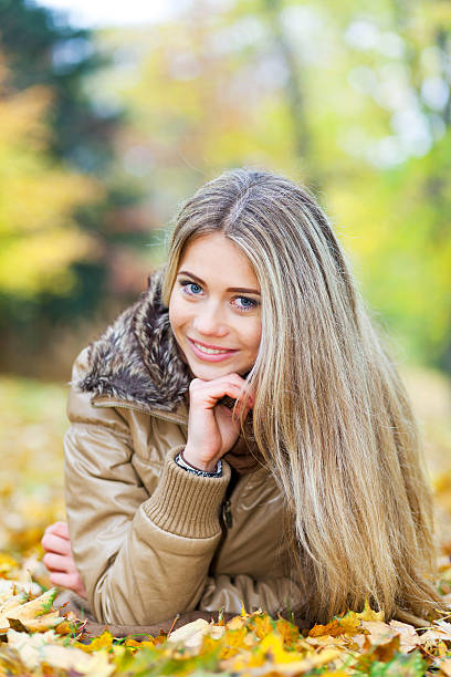 istock Young woman smiling in autumn 158536707