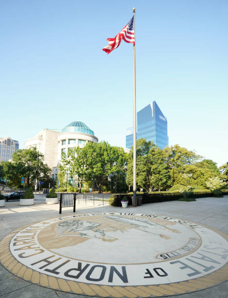 View of downtown Raleigh from the legislative building with the North Carolina state seal in foreground stock photo