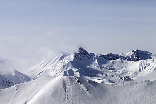 istock Snowy mountains in fog 158537252
