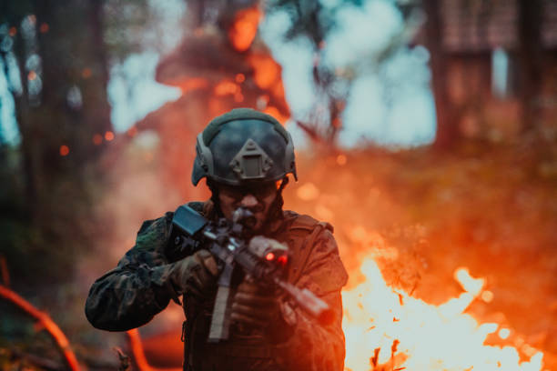 istock A soldier fights in a warforest area surrounded by fire 1585373749