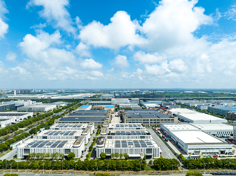 Aerial view of solar panels on manufacturing factory building roof at Shanghai free trade zone,China.