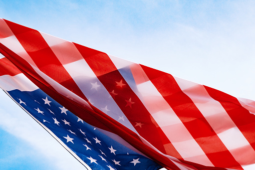 American Flag With Blue Sky And Sunlight - Memorial Day, 4th of July, Labor Day Background