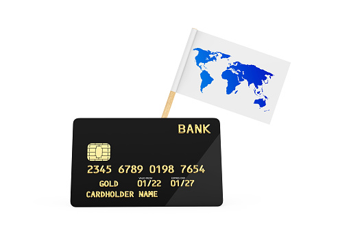 World Map Flag and Black Plastic Golden Credit Card with Chip on a white background. 3d Rendering