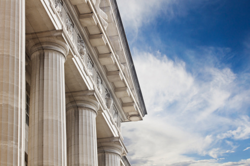 A close up look at a courthouse or government building with lots of copy space to the right