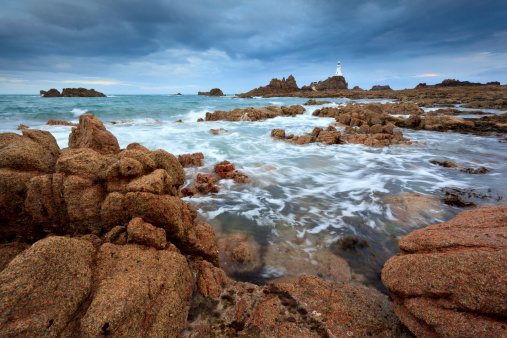 Wide angle shot of La Corbiere lighthouse in Jersey.