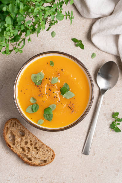 istock Pumpkin soup puree with spices top view. 1585448817