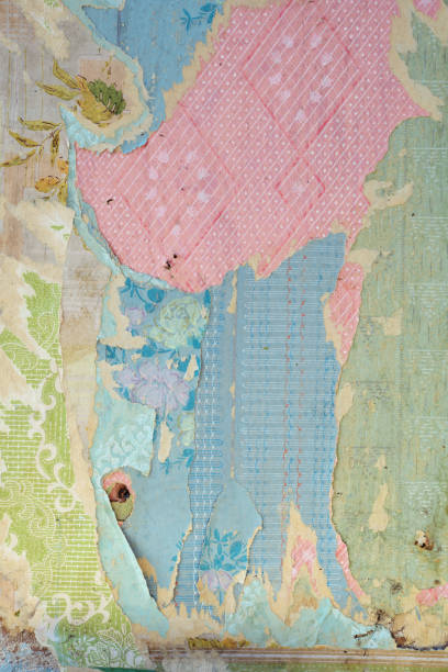 istock Old wallpaper on the wall. Old torn wallpaper for texture or background. 1585449905