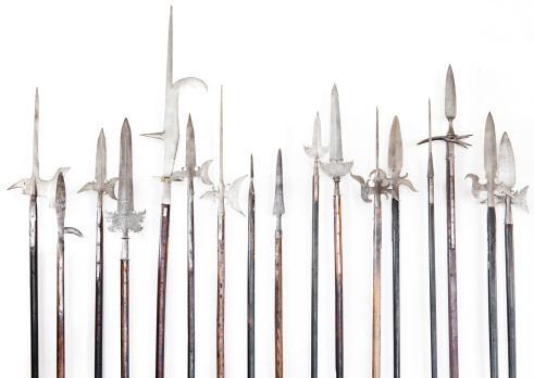 Halberds infront of a white wall.