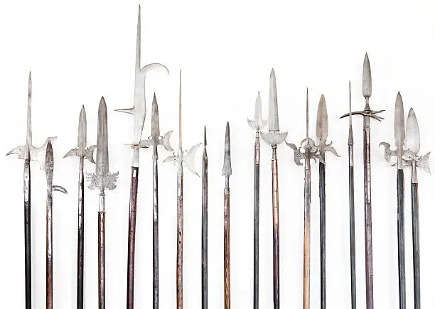 Halberds infront of a white wall.