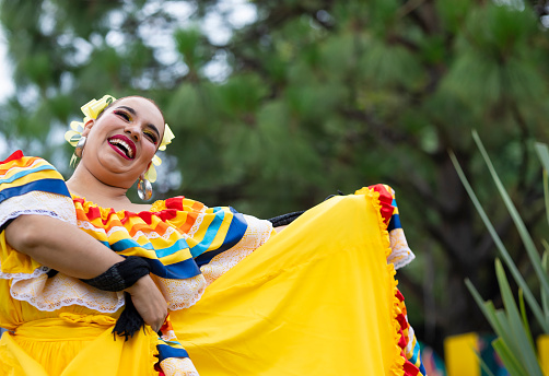 Portrait of a folkloric dancer dancing happily