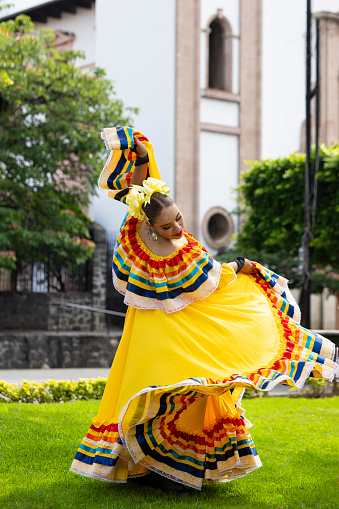 Portrait of dancer enjoying her dance in traditional Jalsico costume