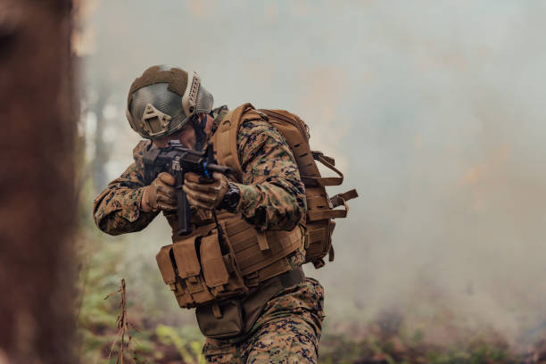 istock A soldier fights in a warforest area surrounded by fire 1585472039
