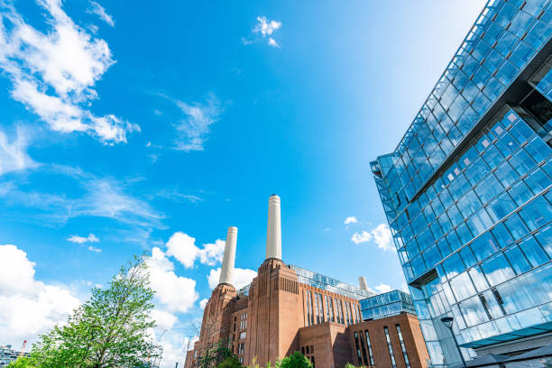 Battersea power station under blue sky Battersea power station under blue sky window chimney london england residential district stock pictures, royalty-free photos & images