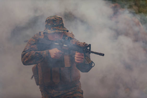 istock A soldier fights in a warforest area surrounded by fire 1585472459