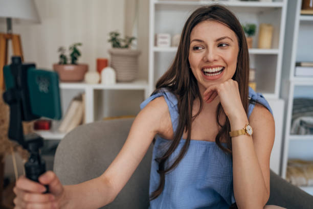 istock Woman vlogging at home 1585473174