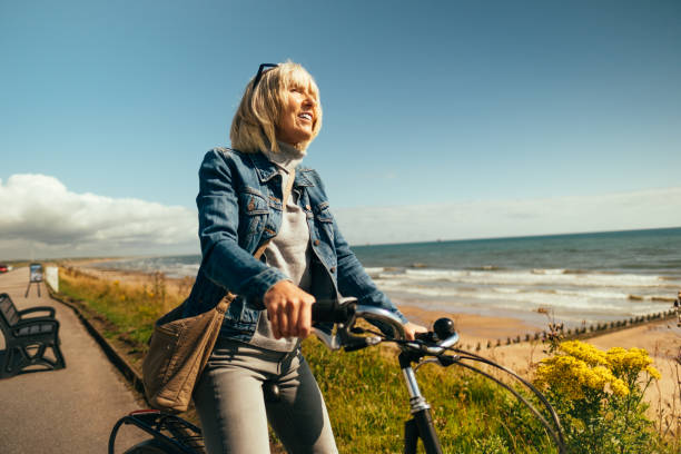 istock Cycling along the Beach Esplanade at Aberdeen,  Scotland 1585484618