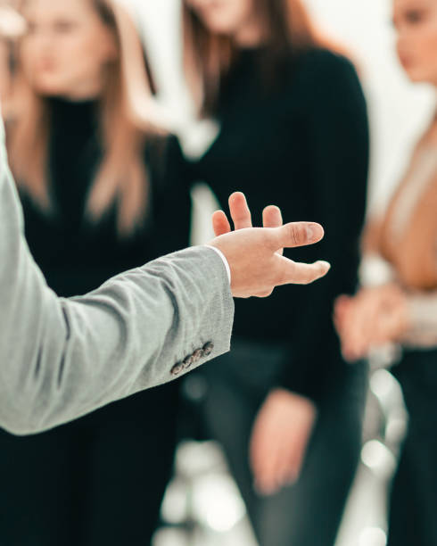 istock cropped image of a speaker making a presentation at a seminar. 1585503848