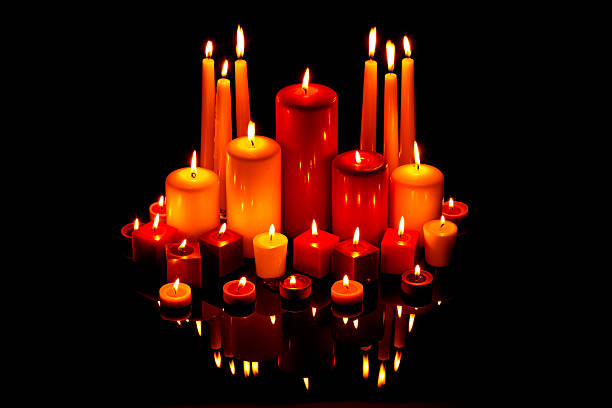 istock Christmas candles on black with reflection 158550790