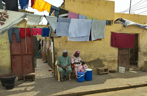 Saint-Louis. Senegal. October 10, 2021. View of the facades of urban residential buildings decorated with stretched clotheslines on which the laundry is dried.