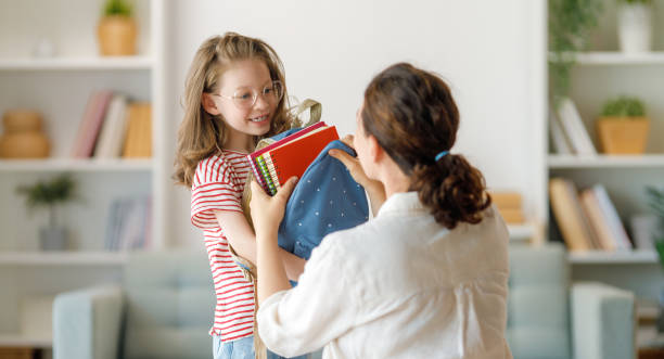 istock Happy family preparing for school 1585517229