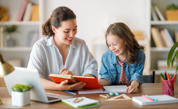 istock Girl doing homework or online education. 1585517235
