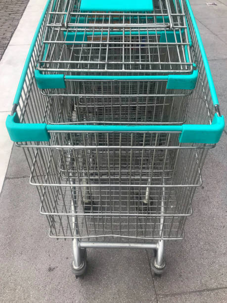 Stainless steel shopping cart at the supermarket. - fotografia de stock