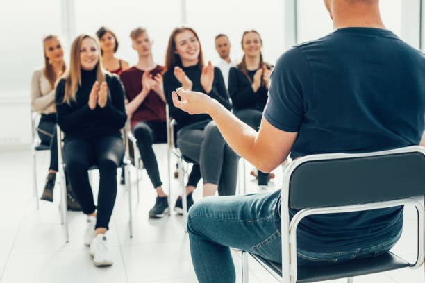 istock working group applauding the business speaker during the meeting . 1585525983