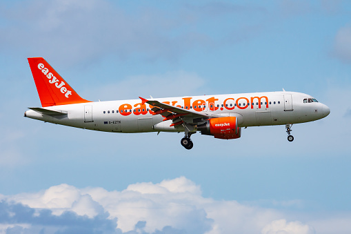 Amsterdam, Netherlands - August 15, 2014: EasyJet passenger plane at airport. Schedule flight travel. Aviation and aircraft. Air transport. Global international transportation. Fly and flying.