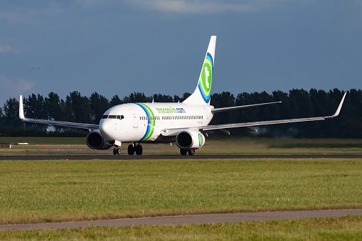 Amsterdam, Netherlands - August 15, 2014: Transavia passenger plane at airport. Schedule flight travel. Aviation and aircraft. Air transport. Global international transportation. Fly and flying.