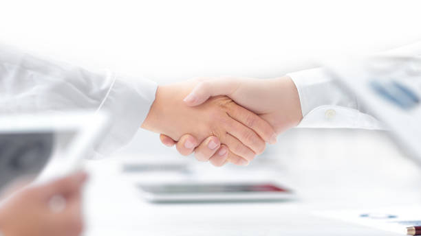 close up. handshake of financial partners after signing the cont stock photo