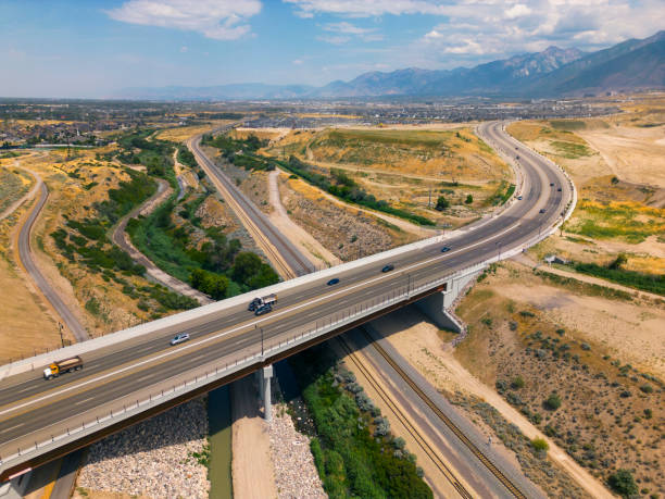 istock Highway Bridge Over Railroad Tracks Aerial 1585534221