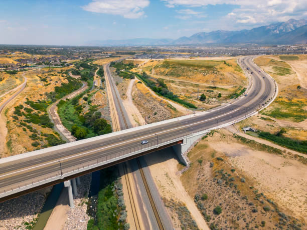 istock Highway Bridge Over Railroad Tracks Aerial 1585534233