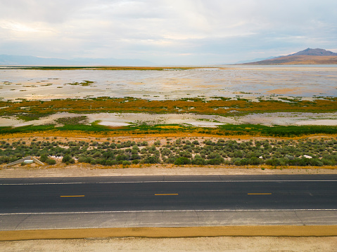 An aerial view of a causeway road in the Great Salt Lake in Utah USA.